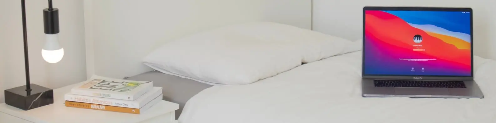 Cozy Workspace With Laptop and Books Background