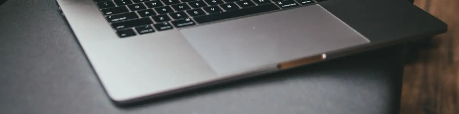 Work Essentials - Laptop Keyboard on Black Desk